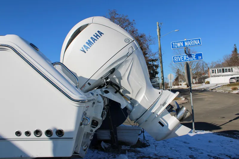 Slide: The Image of 2026 Sea Hunt Gamefish 25 with Yamaha engine near Town Marina and Riverside Drive signs. - 4