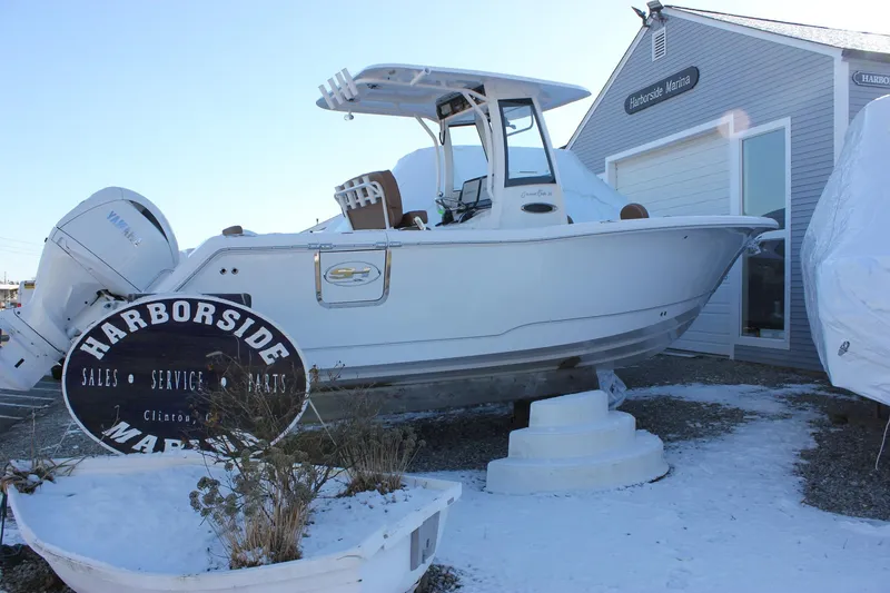 Slide: The Image of 2026 Sea Hunt Gamefish 25 boat displayed at Harborside Marina in winter setting. - 49