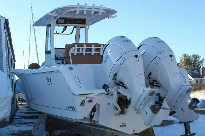 Slide: The Image of 2026 Sea Hunt Gamefish 25 boat with dual Yamaha outboard engines. - 50