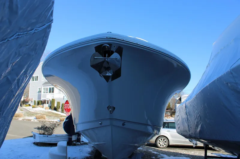 Slide: The Image of 2026 Sea Hunt Gamefish 25 boat, front view, parked outdoors on a sunny day. - 54