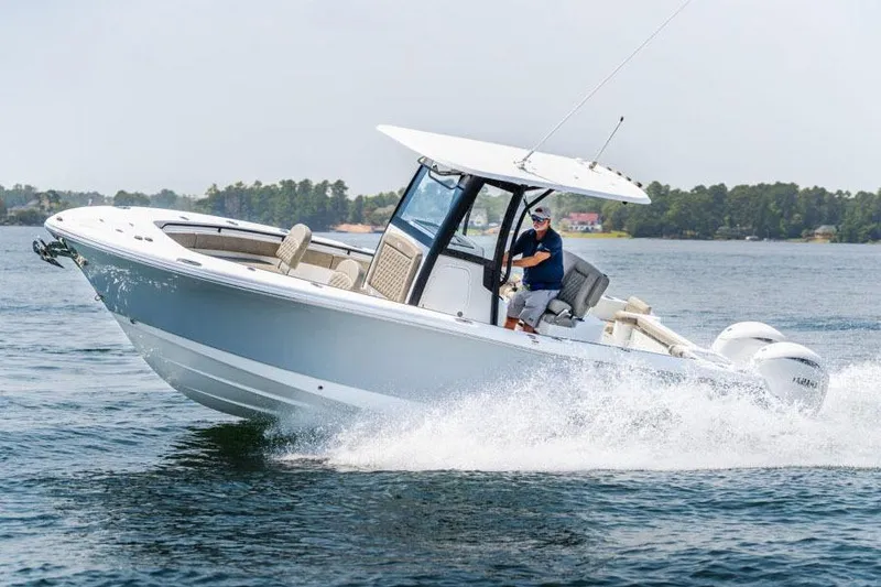Slide: The Image of Manufacturer Provided Image: 2026 Sea Hunt Gamefish 25 cruising on water, showcasing sleek design and powerful performance. - 56