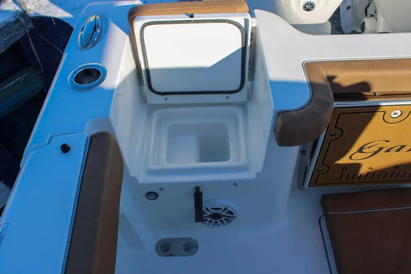 Slide: The Image of 2026 Sea Hunt Gamefish 25 boat interior with open storage compartment and seating. - 9