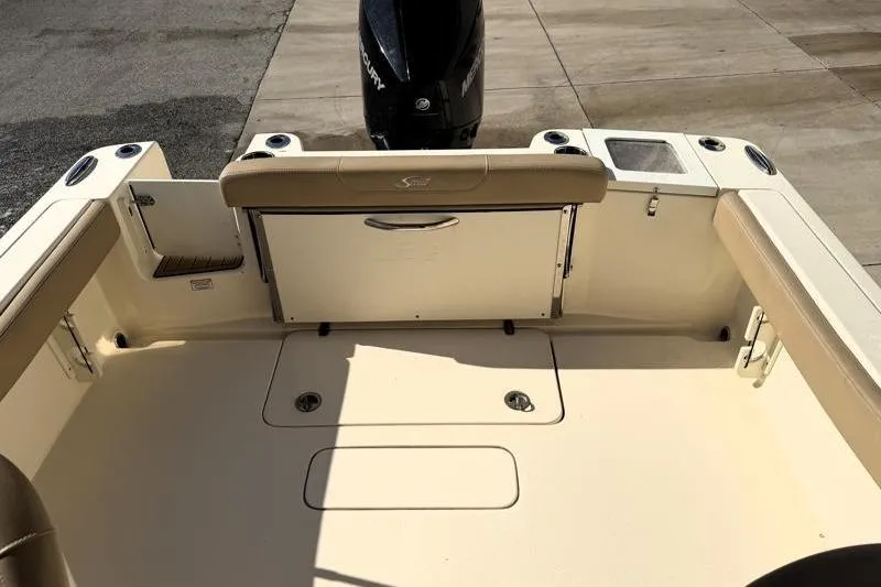 Slide: The Image of 2023 Scout 215 Dorado boat interior with seating and Mercury outboard motor. - 15