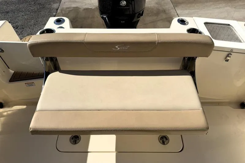 Slide: The Image of 2023 Scout 215 Dorado boat seat with beige upholstery and cup holders. - 17