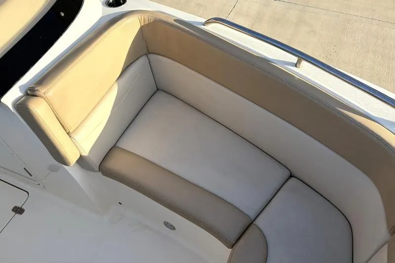 Slide: The Image of 2023 Scout 215 Dorado boat seating with beige and white upholstery. - 19