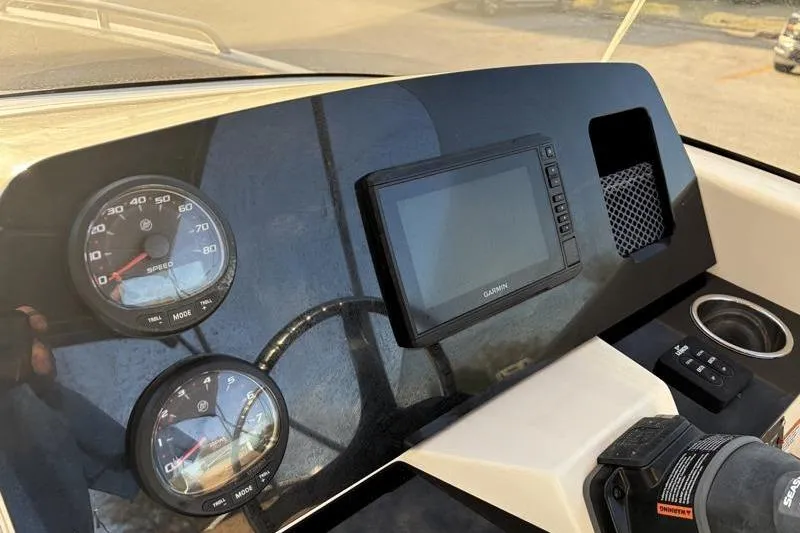 Slide: The Image of Dashboard of 2023 Scout 215 Dorado boat with gauges and Garmin display. - 24