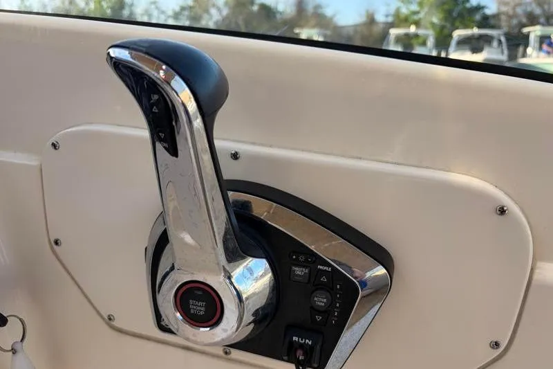 Slide: The Image of Throttle control of 2023 Scout 215 Dorado boat, featuring start/stop button and control panel. - 26