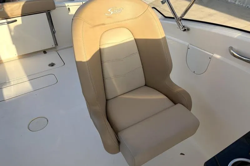 Slide: The Image of 2023 Scout 215 Dorado boat seat, beige leather, sleek design, comfortable marine seating. - 30