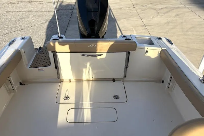 Slide: The Image of 2023 Scout 215 Dorado boat interior with seating and storage compartments. - 31