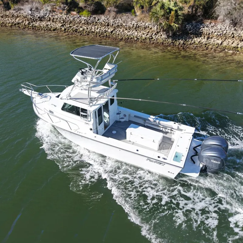 The Image of 2023 Parker 2820 XLD Sport Cabin boat cruising on water. - 0