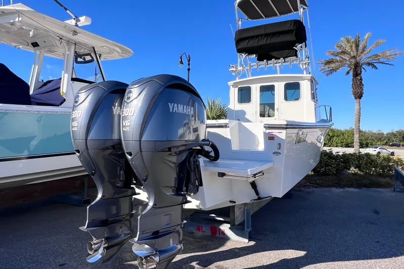 Slide: The Image of 2023 Parker 2820 XLD Sport Cabin boat with dual Yamaha V6 engines. - 10