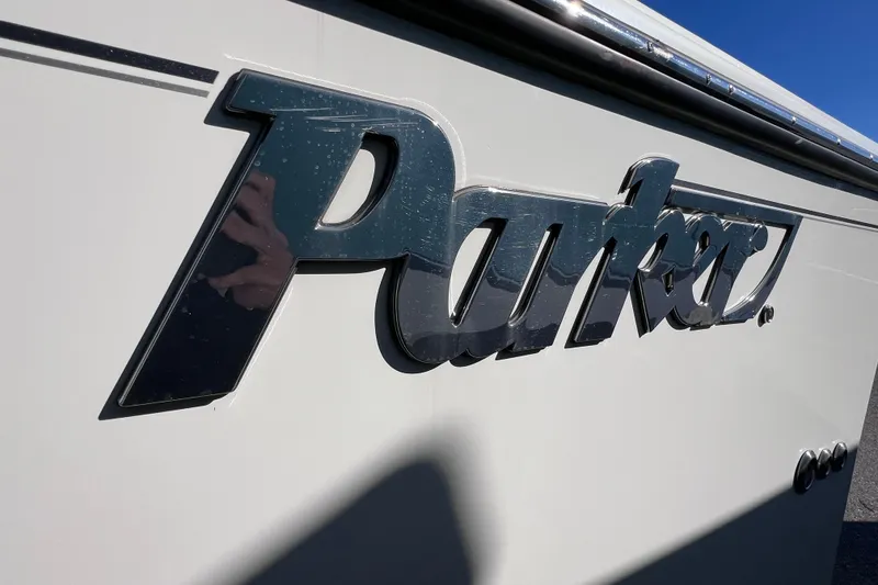 Slide: The Image of Close-up of 2023 Parker 2820 XLD Sport Cabin logo on boat exterior. - 14