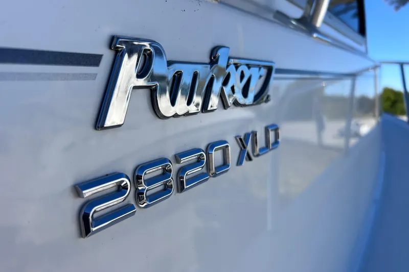 Slide: The Image of 2023 Parker 2820 XLD Sport Cabin boat logo in chrome detail. - 19