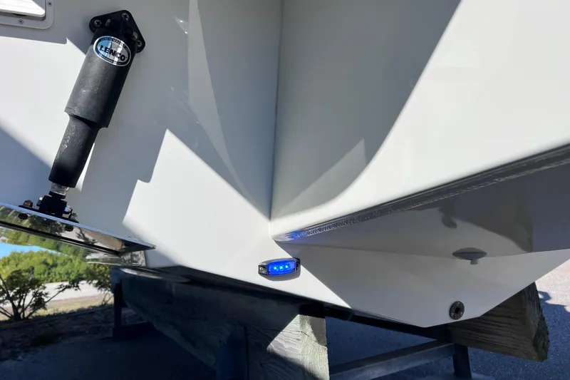 Slide: The Image of Close-up of 2023 Parker 2820 XLD Sport Cabin boat hull with blue LED light. - 22