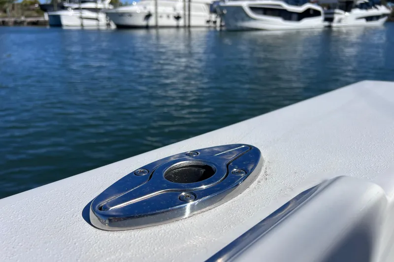 Slide: The Image of Close-up of 2023 Parker 2820 XLD Sport Cabin boat detail with marina background. - 37
