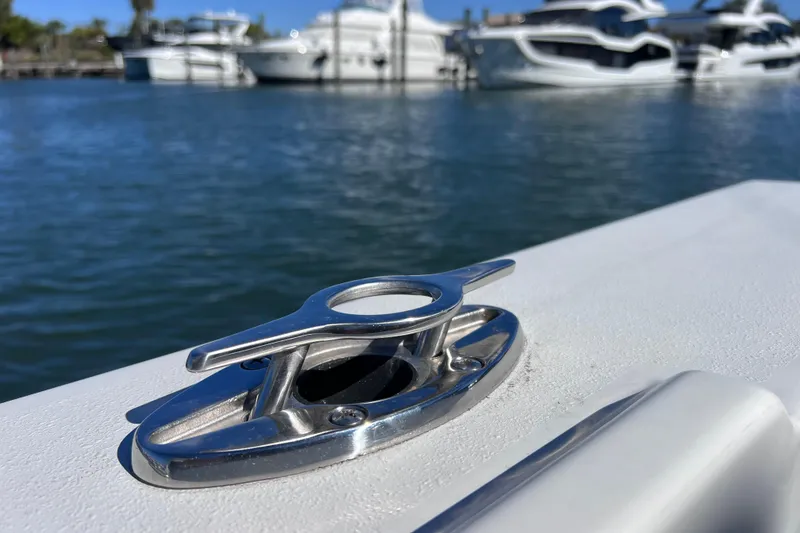 Slide: The Image of 2023 Parker 2820 XLD Sport Cabin boat cleat with marina background. - 38