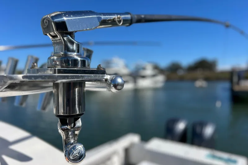 Slide: The Image of Close-up of a Parker 2820 XLD Sport Cabin boat detail, 2023 model, with marina background. - 48