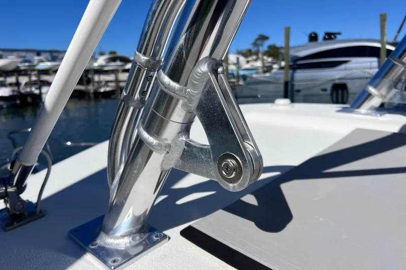 Slide: The Image of Close-up of 2023 Parker 2820 XLD Sport Cabin boat hardware in marina setting. - 49