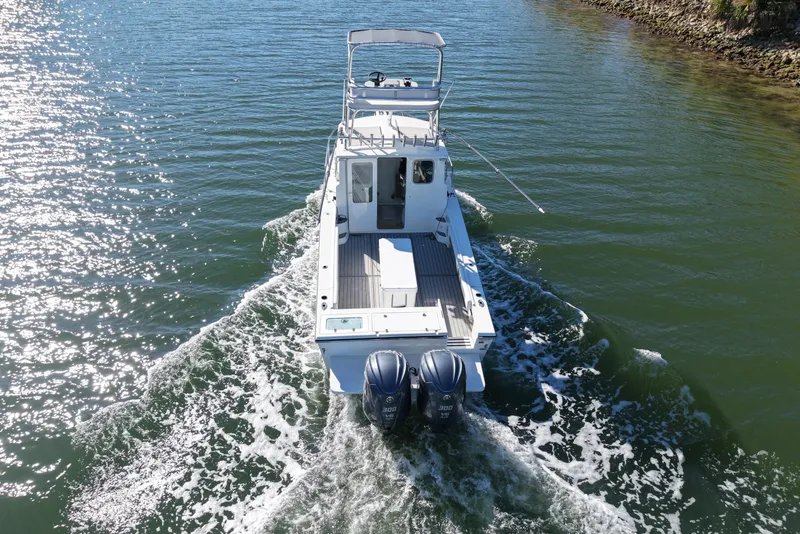 Slide: The Image of Parker 2820 XLD Sport Cabin 2023 on calm waters. - 6