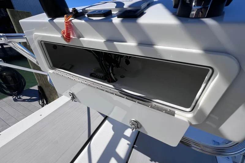 Slide: The Image of Open storage compartment on 2023 Parker 2820 XLD Sport Cabin boat. - 60