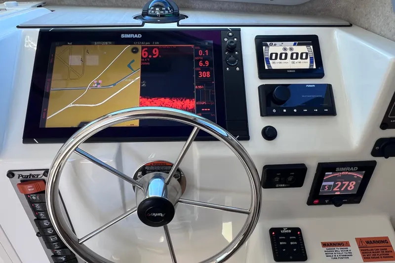 Slide: The Image of Control panel of 2023 Parker 2820 XLD Sport Cabin with Simrad navigation system. - 77