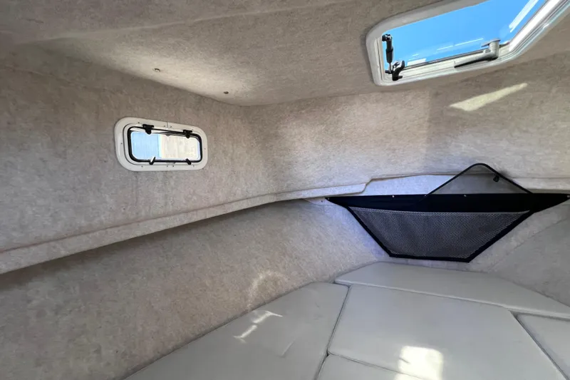 Slide: The Image of Interior cabin of 2023 Parker 2820 XLD Sport Cabin with windows and storage net. - 82