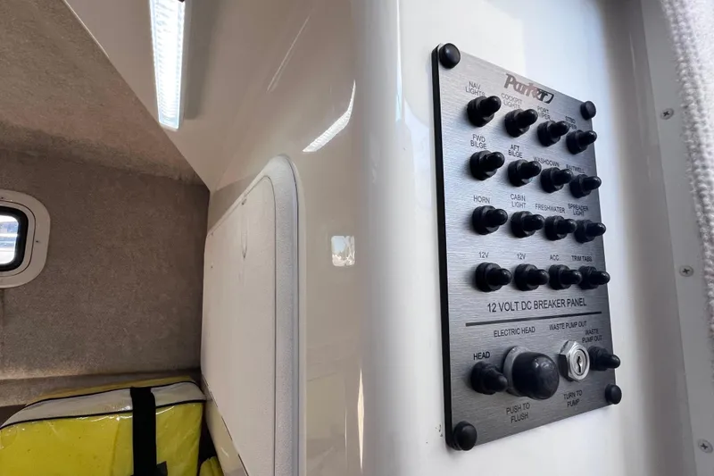 Slide: The Image of 2023 Parker 2820 XLD Sport Cabin interior with 12-volt DC breaker panel. - 85