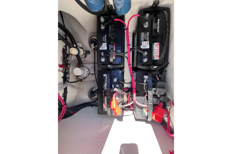 Slide: The Image of Battery compartment of 2023 Parker 2820 XLD Sport Cabin with wiring and components. - 93