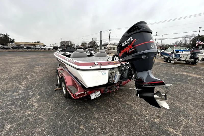 Slide: The Image of 2010 Skeeter 20i boat with Yamaha VMAX engine in parking lot. - 5