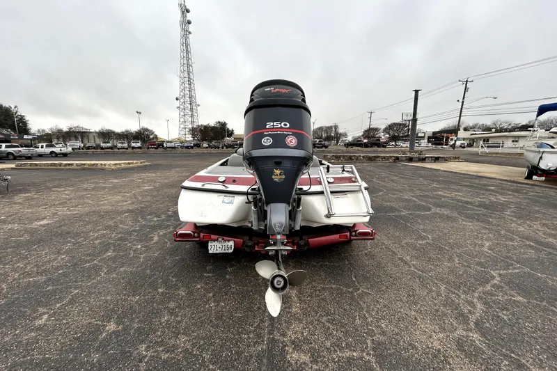Slide: The Image of 2010 Skeeter 20i boat with 250 horsepower engine, parked in a lot. - 6