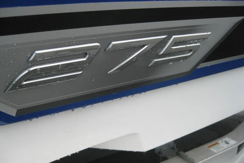 Slide: The Image of 2024 Monterey 275SS Super Sport boat logo with nautical flags on blue background. - 2