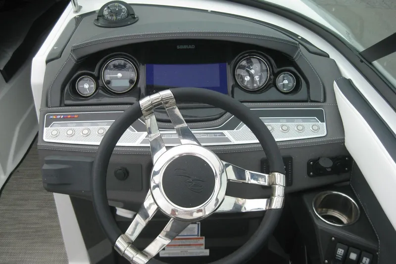 Slide: The Image of 2024 Monterey 275SS Super Sport boat interior with sleek dashboard and steering wheel. - 9
