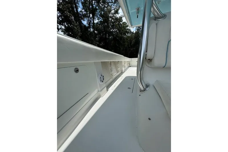 Slide: The Image of 2014 Jupiter 34 boat interior with sleek white deck and stainless steel railing. - 10