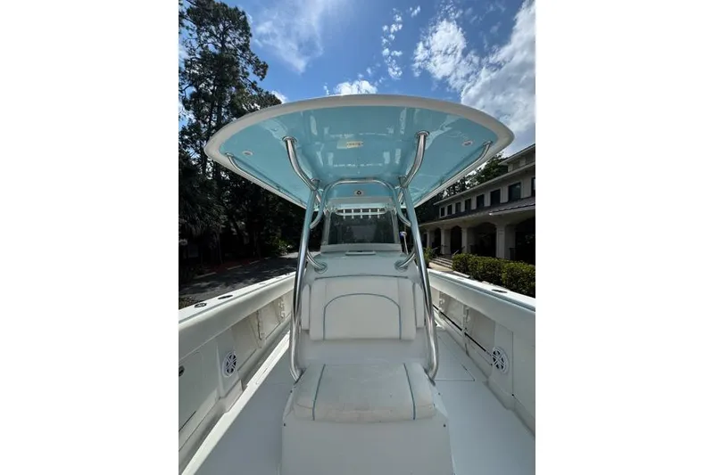 Slide: The Image of 2014 Jupiter 34 boat interior with T-top under a clear blue sky. - 11