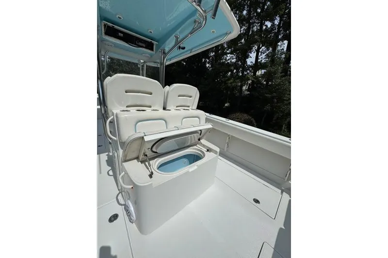 Slide: The Image of 2014 Jupiter 34 boat interior with seating and storage compartment open. - 19