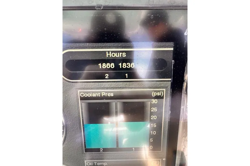 Slide: The Image of Display screen showing engine hours and coolant pressure for 2014 Jupiter 34. - 2