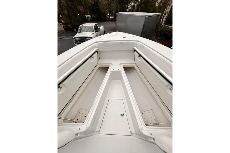 Slide: The Image of 2014 Jupiter 34 boat interior with open storage compartments. - 24