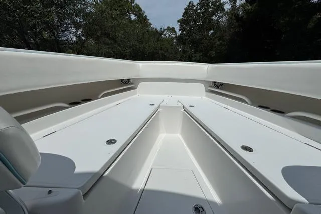 Slide: The Image of 2014 Jupiter 34 boat interior with spacious seating and storage compartments. - 8