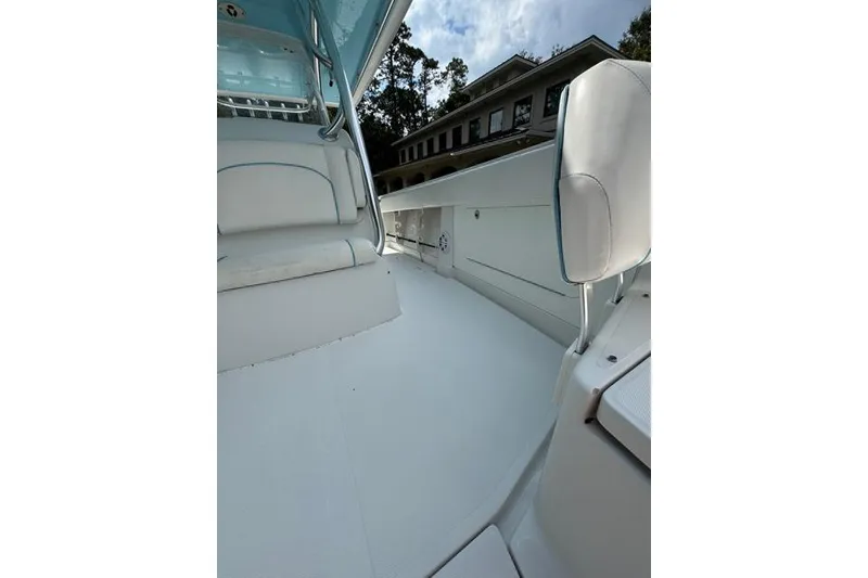 Slide: The Image of 2014 Jupiter 34 boat interior with white seating and sleek design. - 9