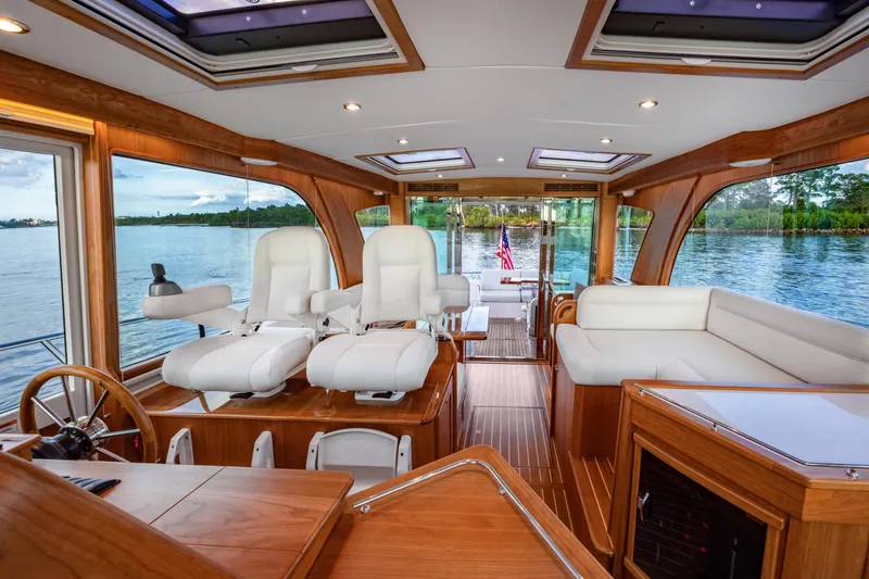 Slide: The Image of Luxurious interior of 2027 Sabre 51 Salon Express yacht with elegant seating and scenic views. - 12