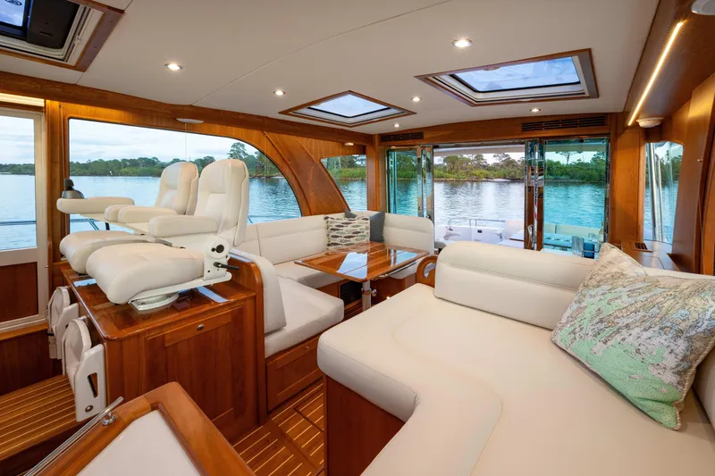 Slide: The Image of Luxurious interior of 2027 Sabre 51 Salon Express yacht with elegant seating and scenic water view. - 13