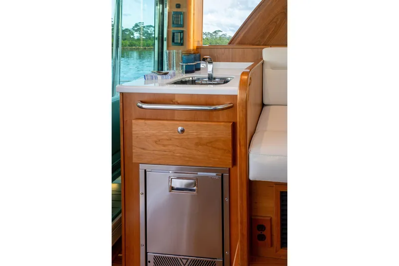 Slide: The Image of Interior of 2027 Sabre 51 Salon Express yacht with wooden cabinetry and compact sink. - 15