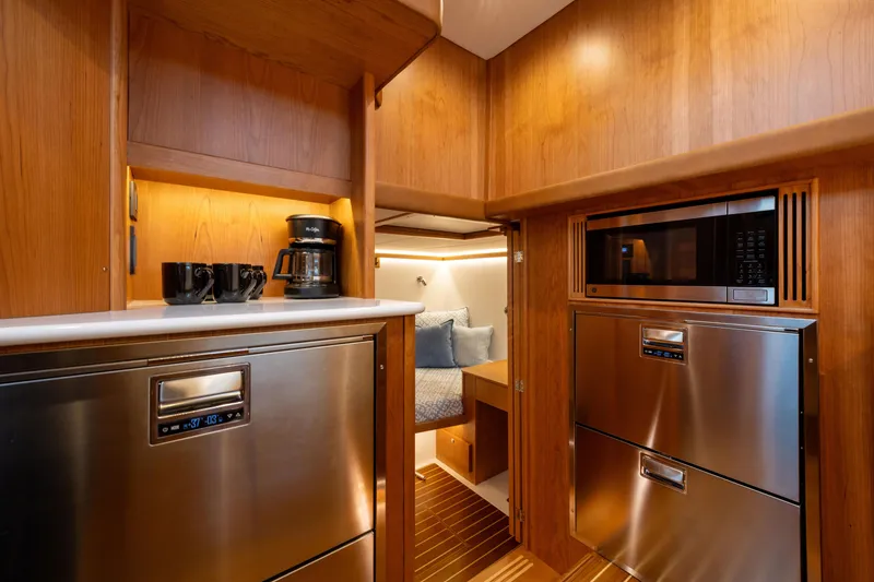 Slide: The Image of Luxurious 2027 Sabre 51 Salon Express interior with modern kitchen and cozy cabin. - 18