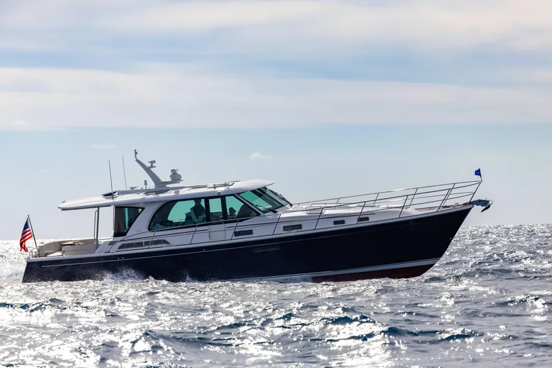 Slide: The Image of 2027 Sabre 51 Salon Express yacht cruising on open water. - 4