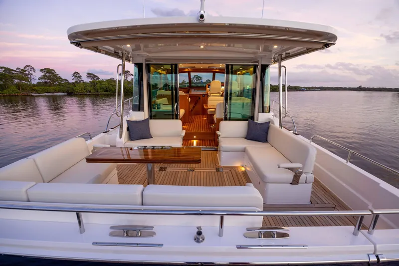 Slide: The Image of Luxurious 2027 Sabre 51 Salon Express yacht with elegant seating and scenic water view. - 9