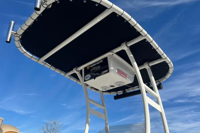 Slide: The Image of T-top of 2016 Sea Pro 208 Bay boat against a clear blue sky. - 7