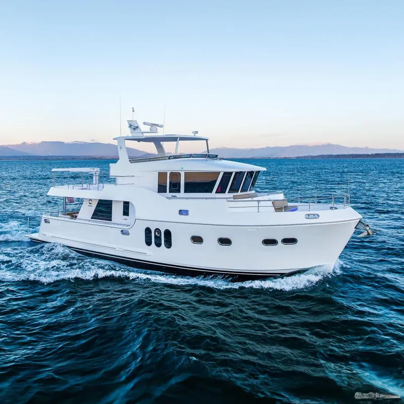 The Image of 2024 Northwest 55 yacht cruising on open sea under clear sky. - 0