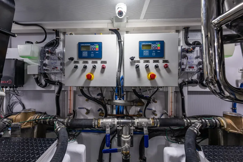 Slide: The Image of Engine room of 2024 Northwest 55 yacht with control panels and piping systems. - 15