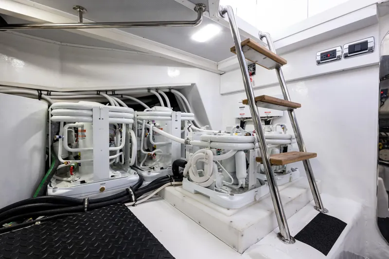 Slide: The Image of Engine room of 2024 Northwest 55 yacht with machinery and ladder. - 25