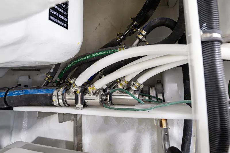 Slide: The Image of Engine room piping and hoses in a 2024 Northwest 55 model boat. - 26